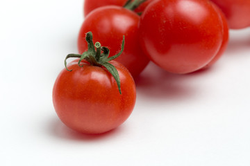 Cherry tomatoes on white background