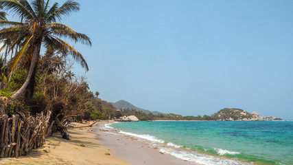 Obraz na płótnie Canvas tropical beach with turquoise water at tayrona natural park