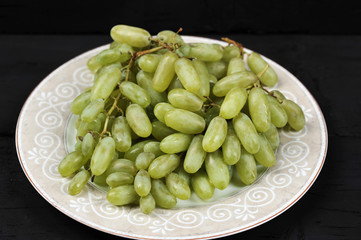 Tasty fresh green grape in a plate