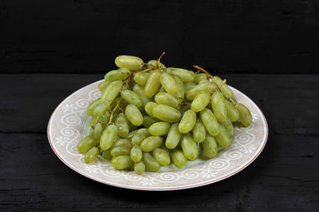 Tasty fresh green grape in a plate