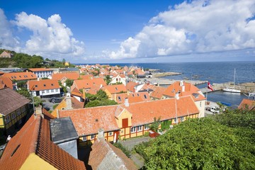 Aerial view of small town - with beautiful, small houses - at the seaside, Gudhjem, Bornholm, Denmark