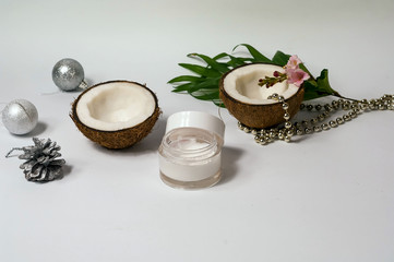 Obraz na płótnie Canvas Scrub,coconut products on white background. Decorative Garland and silver balls, Christmas decor.Top view, flat lay, copy space, closeup