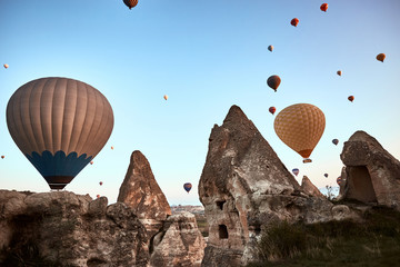 Mountain landscape with large balloons in a short summer season at dawn.
