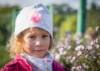 Portrait of little girl in an autumn colors.