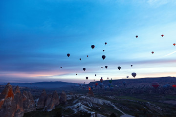 Mountain landscape with large balloons in a short summer season at dawn.