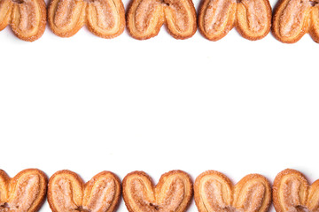Frame of cookies hearts on an isolated white background