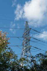 Large power pylon, blue sky background