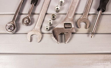 Top view of working tools on wooden background. Construction concept.