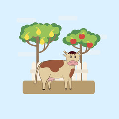 Cute cow in the garden with apple and pear trees