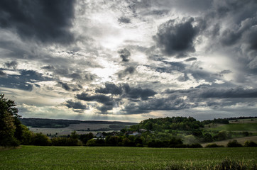Fototapeta na wymiar Black clouds over the village