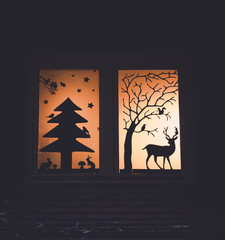 Image of window decoration with forrest fairy tale silhouettes