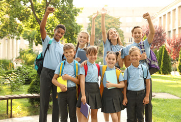 Group of children in stylish school uniform outdoors