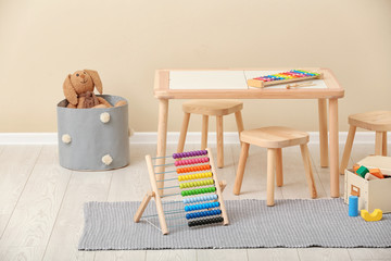 Stylish child's room interior with toys and new furniture