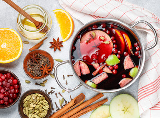 Mulled wine is a traditional winter drink with red wine, honey, orange, green Apple, cranberry and spices - cinnamon, cardamom, star anise, cloves, ginger, pepper. grog. punch. Christmas. New year