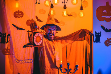 Holiday celebration symbols on brick wall. Halloween, holidays celebration. Funny wise wizard on a...