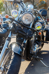 Naklejka premium Close-up of motorcycle parked on city street