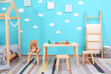 Beautiful child room interior with wooden furniture and toys