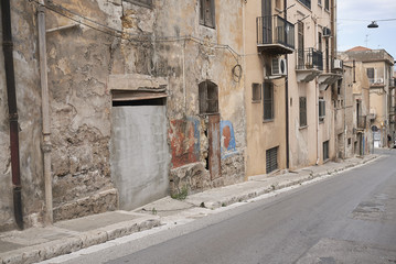 Fototapeta na wymiar Castellammare del Golfo, Italy - September 04, 2018 : View of Castellammare del Golfo empty streets
