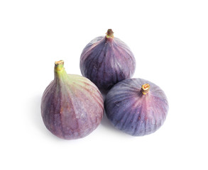Whole ripe purple figs on white background