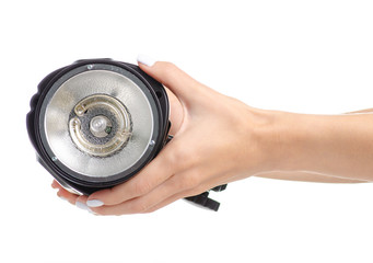 Studio flash equipment in hand on white background isolation