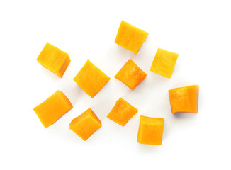 Fresh raw pumpkin pieces isolated on white, top view