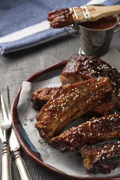 Juicy bbq pork ribs with spicy sauce in a plate