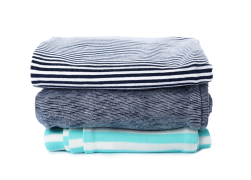 Stack of folded child clothes isolated on white