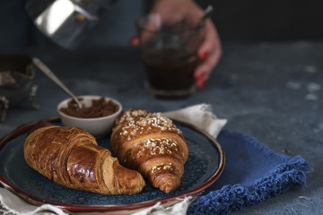 Croissants in a plate. Freshly baked croissants. Copyspace