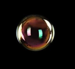 Beautiful translucent soap bubble on dark background. Space for text