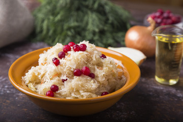 Tasty sauerkraut with berries,  onion and olive oil