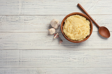 Obraz na płótnie Canvas Flat lay composition with mashed potatoes on wooden background. Space for text