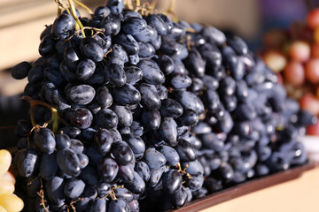 Fresh ripe juicy grapes on tray, closeup