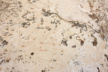 Old wall with cracks of white gypsum