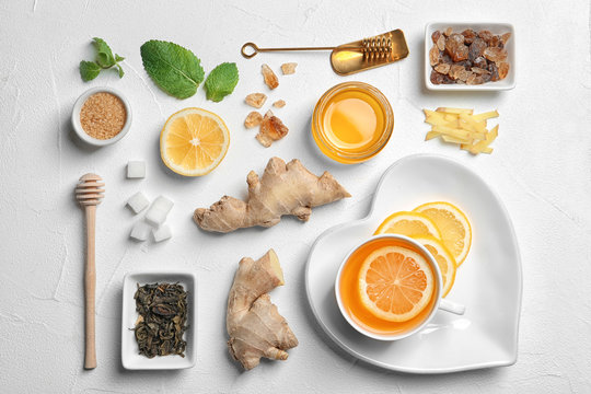Flat lay composition with tea and therapeutic products on white background