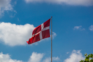 Danish flag on a sunny day with a clear blue sky