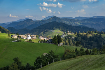 Fototapeta na wymiar Slovenia, the small village of Spodnja is nestled between de mountain ranges of the Julian Alps