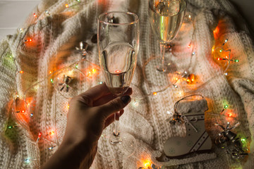 The glasses of champagne and christmas decoration.