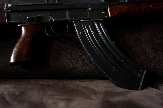 Low key photo of AK-47 Kalashnikov rifle. Dark themed automatic rifle from Russia/Soviet union.