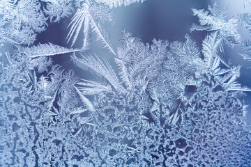 Frosty pattern on the glass window. Abstract, background