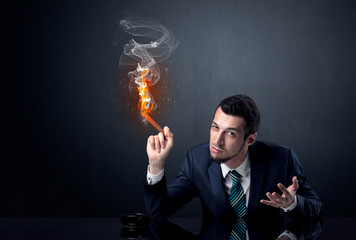 Businessman smoking with inferno effect.
