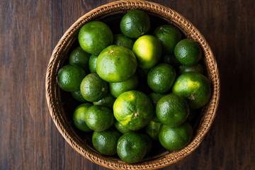 Green Tangerine Mandarins in Wooden Bowl