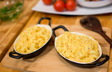 Macaroni and Cheese in cozy kitchen autumn and fall comfort foods cooking background