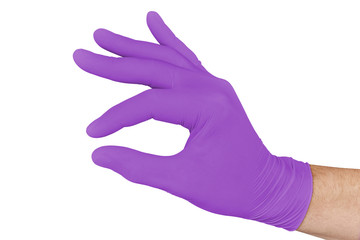Hand in violet medical glove pretending to hold medicine isolated on white background