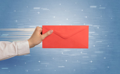 Female hand holding empty and full envelope with blue background and direction concept
