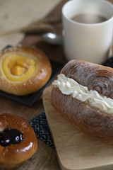 Bakery set of various breads, Cream bread, Blueberry liberty bun, Mini peach crumble and coffee.