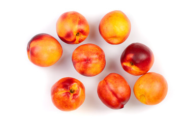 ripe nectarine with leaves isolated on white background. Top view. Flat lay pattern