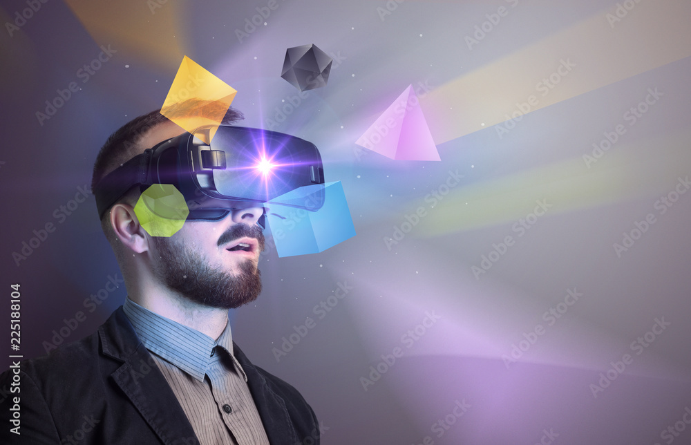 Poster amazed businessman with virtual reality colorful geometric shapes in front of him