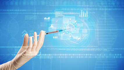Female doctor hand holding syringe with blue background and charts