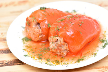 Stuffed pepper with meat, rice and carrots. Healthy food. Restaurant dish.