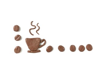 A cup of hot coffee placed in the lower left corner with coffee beans arrange line are handmade from brown plasticine clay on white background, delicious caffeine drink dough